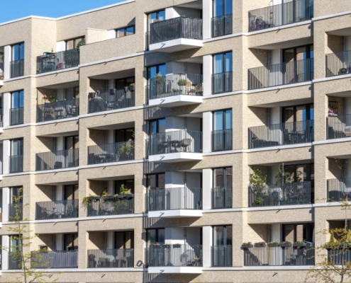 cafrad blattes lutte copropriete Immeuble moderne avec balcons ensoleillés.